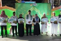 Bupati Barito Utara, H. Shalahuddin, memberikan apresiasi kepada peserta Pawai Tanglong Barito Utara Bertakbir di Muara Teweh, Selasa malam (26/5/2026). 